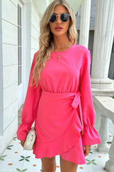 Women wearing a pink Ruffle Hem Mini Dress with flounce sleeves and shiny finish, standing outdoors. Fashionable and elegant look.