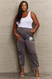 Model wearing Graphic Sweatpants with "CELESTIAL DREAMER" print, showcasing relaxed style and comfort for everyday wear.