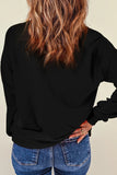 Back view of model wearing Spooky Sweatshirt with round neck and long sleeves, featuring glitter detailing for a stylish look.