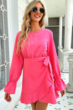 Woman wearing a pink Ruffle Hem Mini Dress with shiny flounce sleeves, standing outdoors.