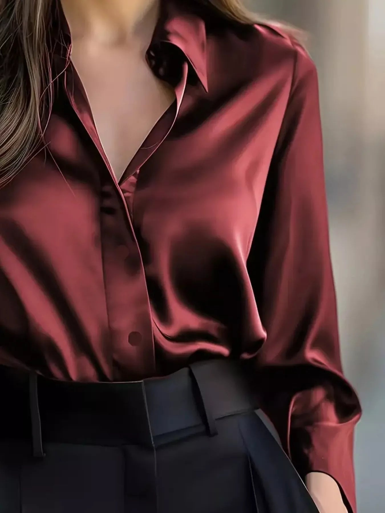 Woman wearing a Button Down Long Sleeve Shirt with a collared neckline in a deep burgundy color.