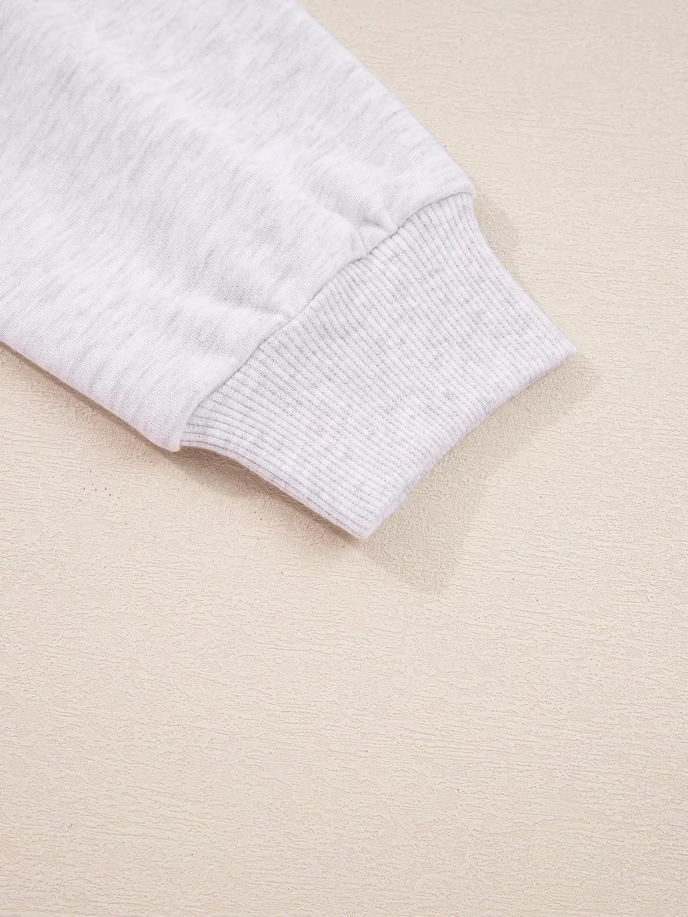 Close-up of sleeve detailing on the Contrasted Trim Pant Set, showcasing the ribbed cuff and soft fabric texture.