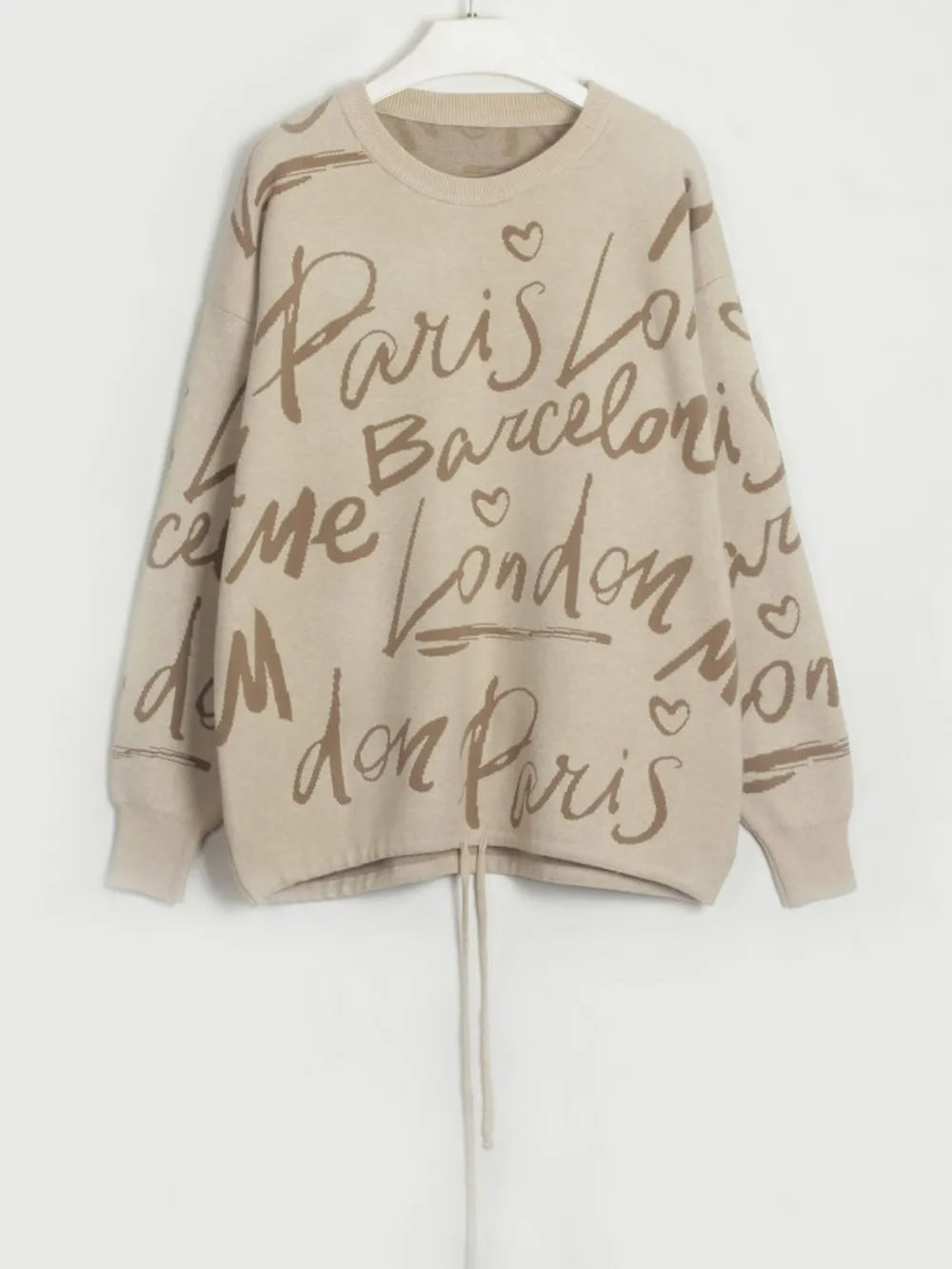 Letter Pattern Sweater with drawstring hem and dropped shoulder design, featuring city names like Paris and London in playful lettering.