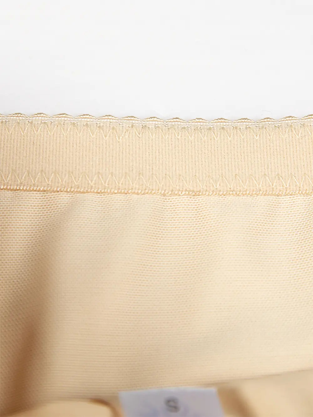 Close-up of beige Lace Detail Shaping Shorts by Felvior showing the intricate lace and smooth fabric for a flattering silhouette.