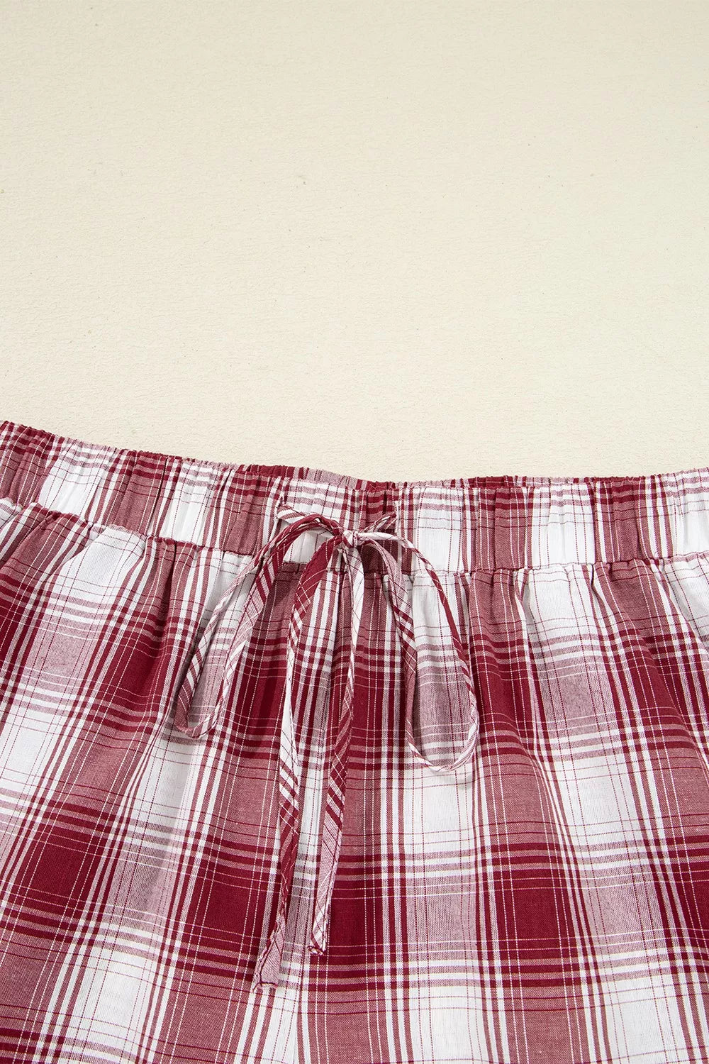 Plaid Long Sleeve Lounge Set featuring close-up of plaid drawstring shorts in red and white.