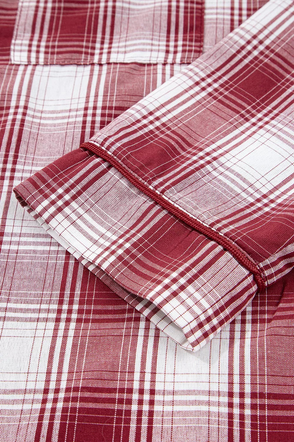 Red and white plaid fabric detail of the Plaid Long Sleeve Lounge Set, featuring soft and breathable 100% cotton material.