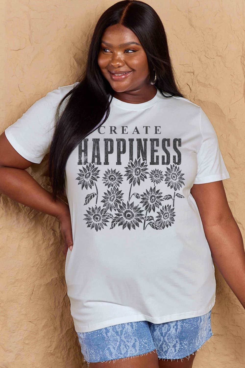 Woman wearing Graphic Cotton T-Shirt with CREATE HAPPINESS print, casual style