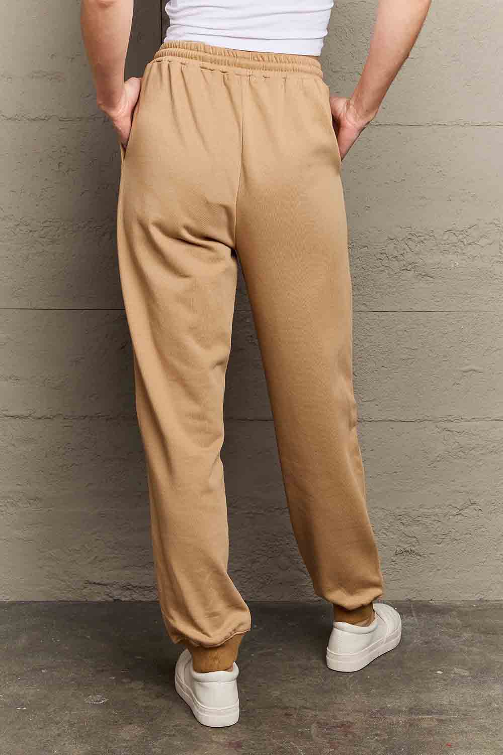 Back view of Graphic Sweatpants featuring an emoji print, relaxed silhouette, and drawstring waist, perfect for casual style.