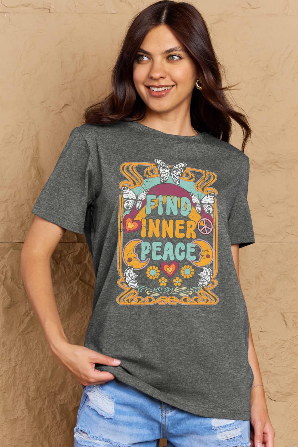 Woman wearing Graphic Cotton T-Shirt with "FIND INNER PEACE" print, casual style
