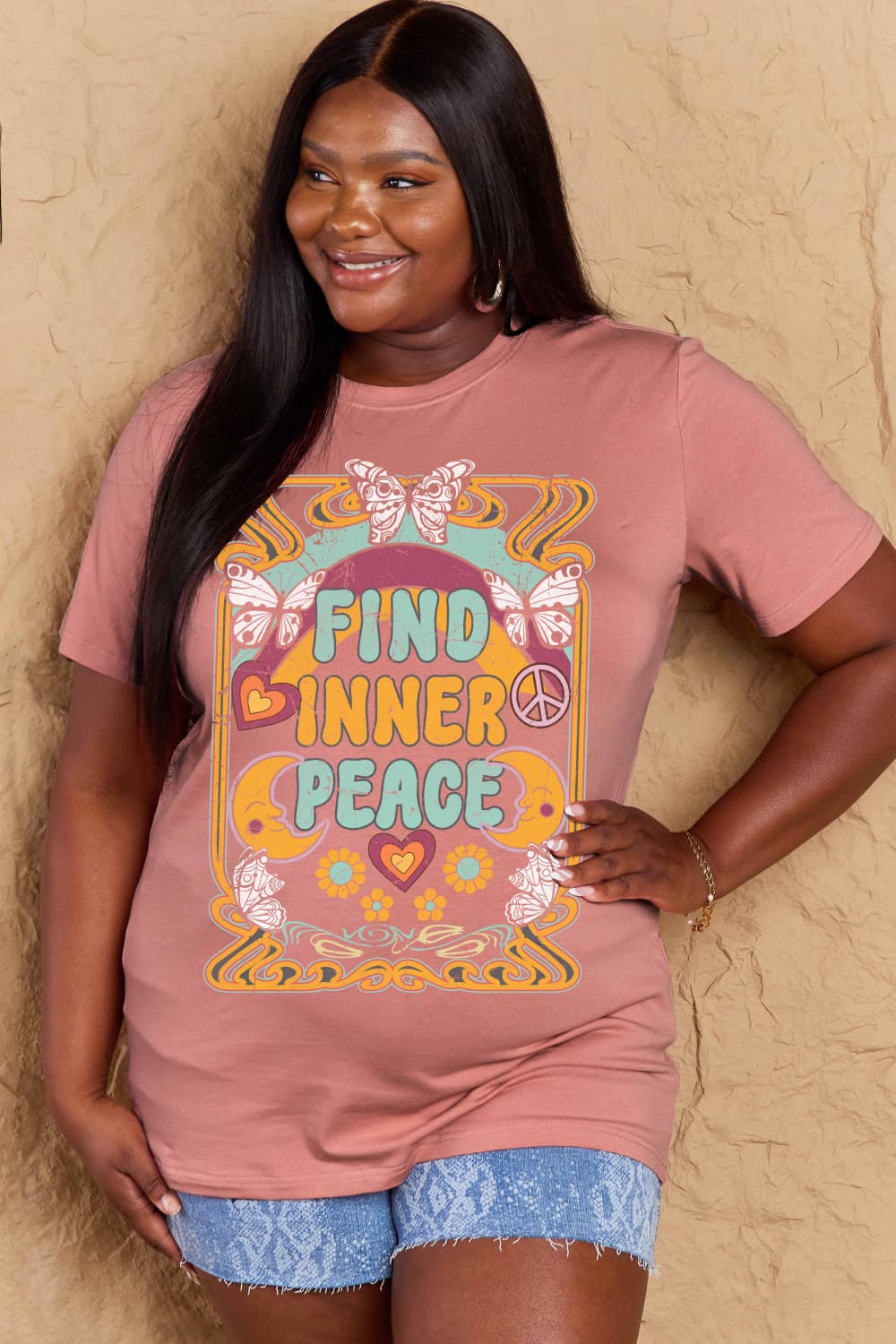 Woman wearing Graphic Cotton T-Shirt with 'FIND INNER PEACE' design, promoting comfort and positivity in casual wardrobe.