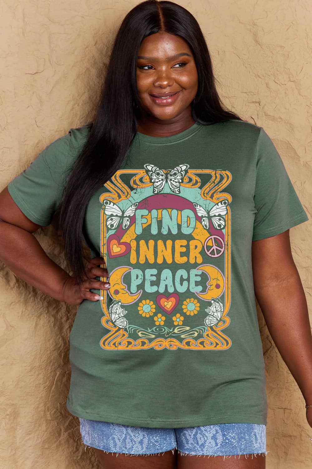 Woman wearing Graphic Cotton T-Shirt with 'FIND INNER PEACE' design for casual style and comfort.