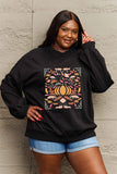 Graphic Dropped Shoulder Sweatshirt with autumn design, worn by model. Casual full-size top ideal for comfortable layering.