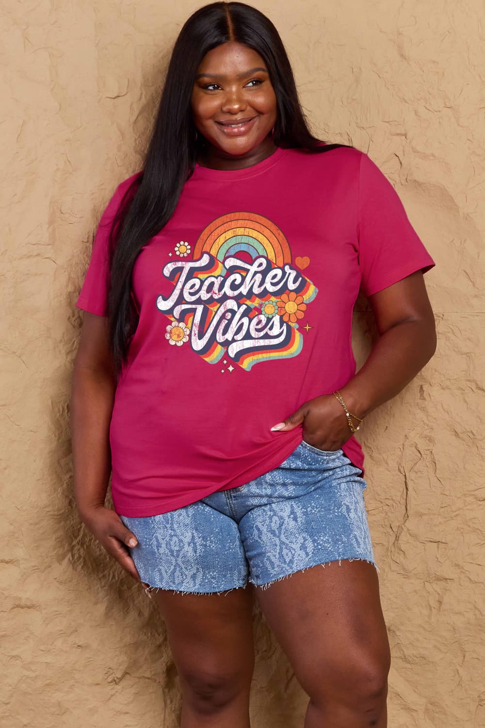 Woman wearing Graphic Cotton T-Shirt with 'TEACHER VIBES' slogan, perfect for casual teacher wear and full-size fashion.