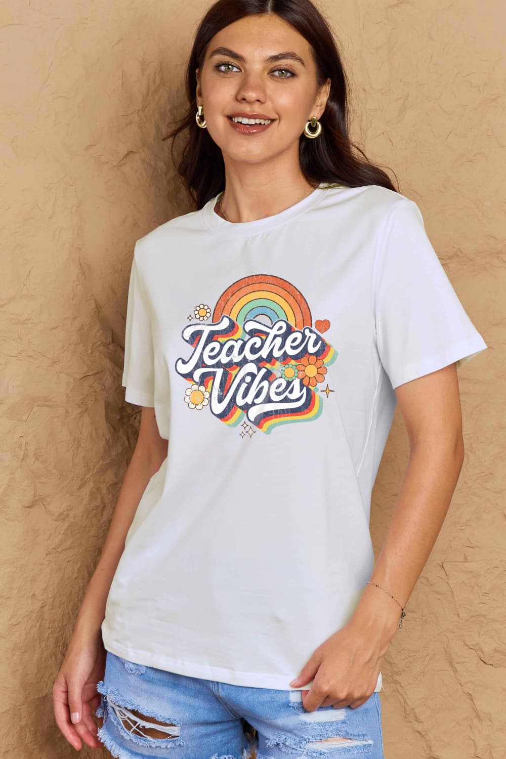 Graphic Cotton T-Shirt featuring 'TEACHER VIBES' print, casual wear for teachers, displayed on model in jeans.