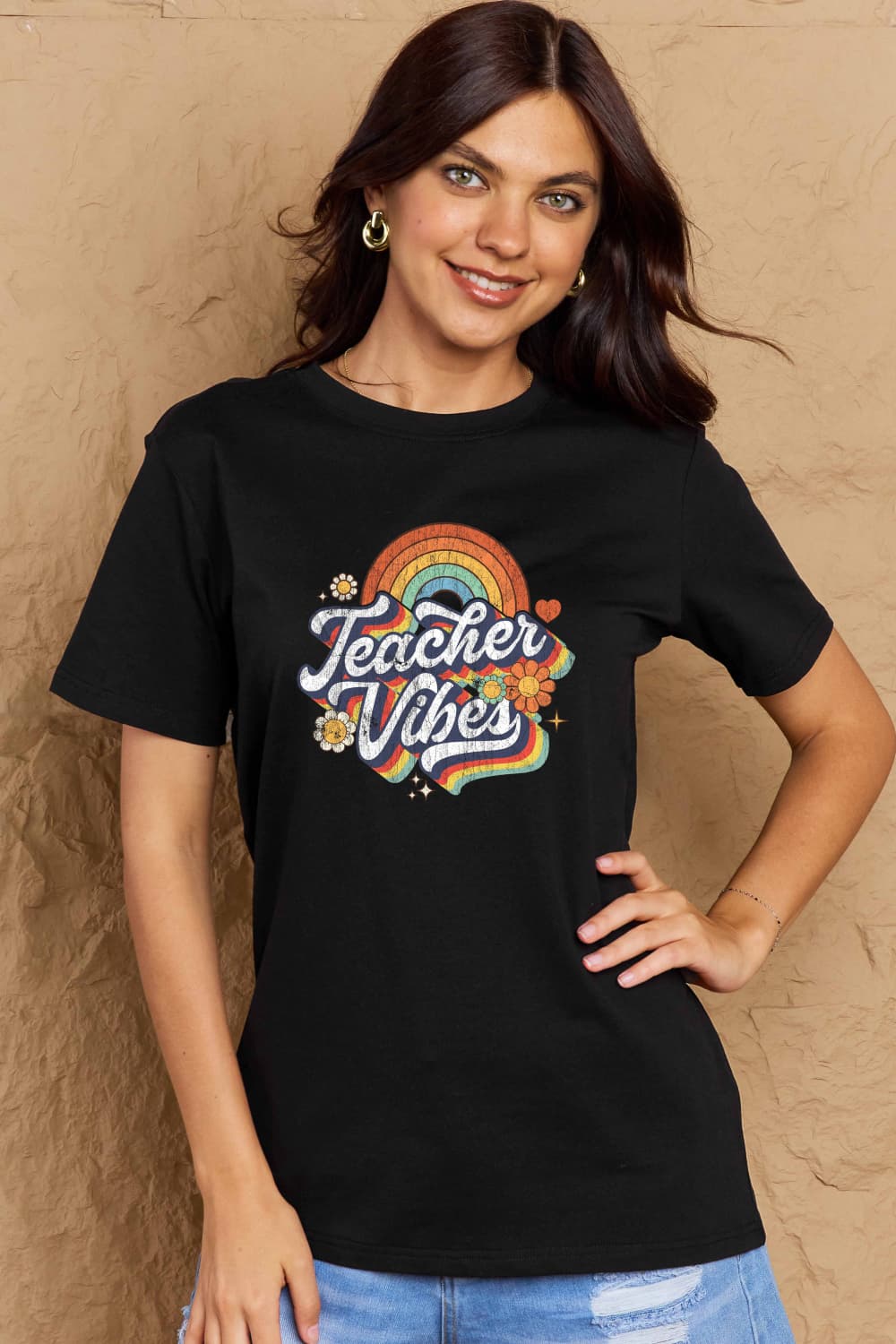 Woman wearing Graphic Cotton T-Shirt with TEACHER VIBES print, showcasing casual style for teachers.
