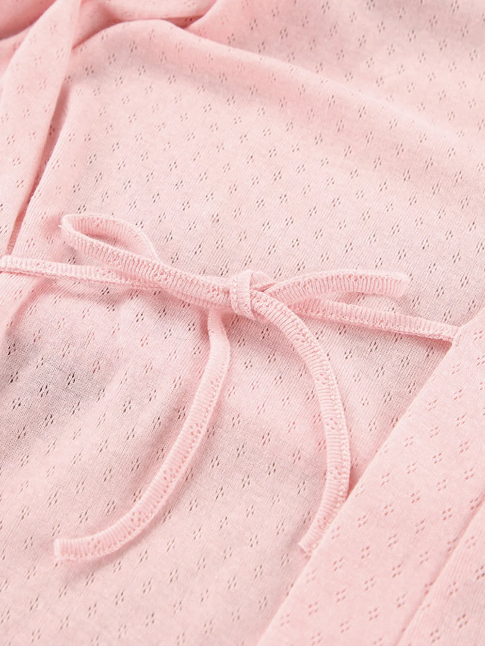 Close-up of pink Tie Waist Lounge Nightgown fabric with tie detail, showcasing kimono sleeve design for comfortable elegance.
